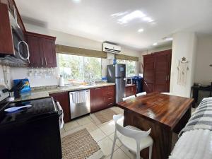 Sunny 2BR Condo with Pool Steps to Town & Beach