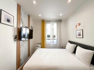 UrbanFlat 115 - Grand Duplex dans le centre de Paris
