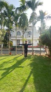 Shantiniketan Bungalow with green lawn