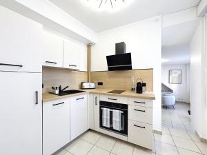 Le 24 appart rez-de-chaussée hyper-centre avec place de parking