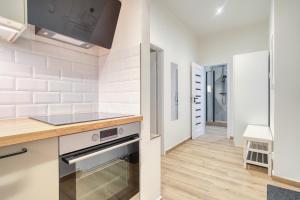 Modern City Apartment with Balcony by Rentez