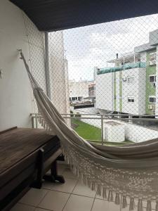 Apê à beira-mar aconchegante com sacada gourmet