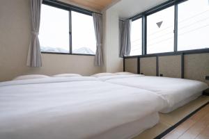 AURA YUZAWA Apartment Hotel - 1Bedroom Apartment with Living Dining Kitchen Sleeps 2 to 4, Bedroom with 2-Double Bed, Living Room with 1-Sofa Bed
