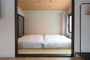 AURA YUZAWA Apartment Hotel - Spacious 1Bedroom Apartment with Large Living Room Sleeps 4 to 6, Bedroom with 2-Double Beds, Living Room with 1-Double Bed & 1-Sofa Bed