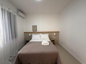 Apto no coração dos Ingleses 150 m da praia C08