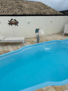 Casa Imbé com piscina 4 quartos