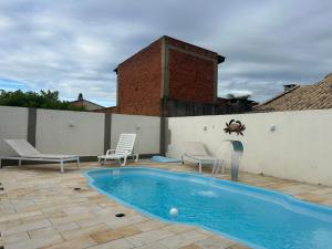 Casa Imbé com piscina 4 quartos