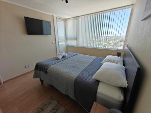 Amplio departamento en pleno centro de Chillán con estacionamiento privado