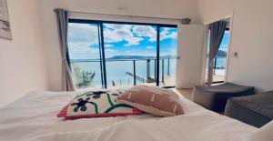 Peaceful Waterfront Retreat with Private Jetty Near Train