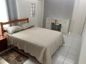 Anitápolis central -apartamento com jardim