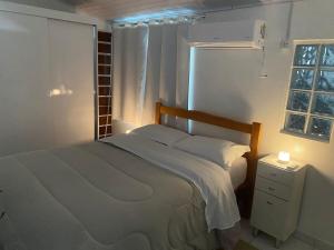 Anitápolis central -apartamento com jardim