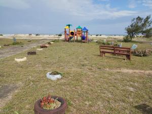 Casa em Tramandaí - 150m do Mar, Ar Cond, Churrasqueira e Wi-fi