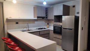 Departamento AYLLU para 4 personas, con piscina Frente a la playa en Laucho, cerca del centro