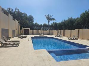 Hawana Salalah - Cozy 1BHK with Outdoor Pool هوانا صلالة - شقة مع مسبح خارجي