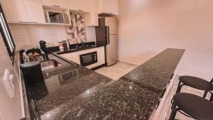 Casa 3 quartos sendo 1 suite ar Cond com piscina 300 metros da praia