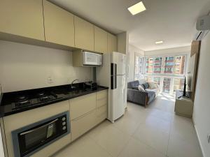 Apto decorado com 2 quartos e piscina no rooftop