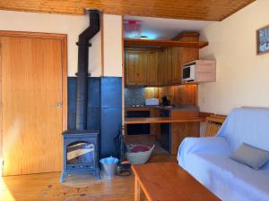 Chimenea, confort moderno y madera - Falcó 2