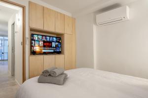 Logement elegant avec patio prive et climatisation