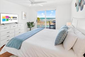 Ground floor direct oceanfront 22 with a balcony, heated pool, and garage parking