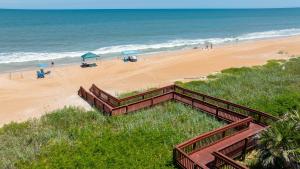 Ground floor direct oceanfront 22 with a balcony, heated pool, and garage parking