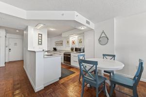 Ground floor direct oceanfront 22 with a balcony, heated pool, and garage parking