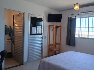 Studio completo, Ar, Tv, Wifi, perto de tudo