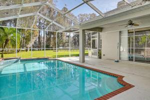 Dock, Lanai and Pool! Modern Red Bug Lake Retreat