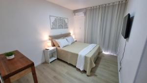 Amplo apartamento de 3 quartos a 120m da praia, com vista mar