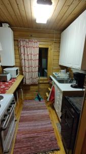 Log cabin on the banks of Ounasjoki River