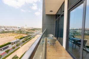 Vogue Vacation Homes, Khalifa City The Gate near Yas Island and Ferrari World, One Bedroom Apartment with Balcony and City view, Access toAmenities