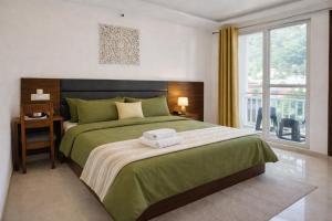 Ima Ganga Hotel - Aesthetic, Quite Mountain View Rooms In Upper Tapovan with netflix, free airport pickup for 7 or more nights booking