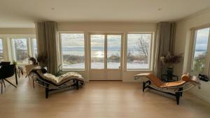 Swedish Timber House Overlooking Lake Arresø