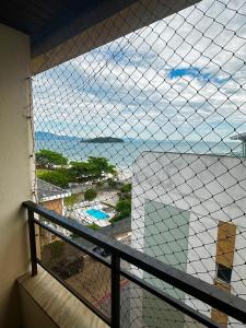 C112 Apartamento de 1 quarto pé na areia com vista lateral ao mar em Canasvieiras