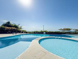 C112 Apartamento de 1 quarto pé na areia com vista lateral ao mar em Canasvieiras