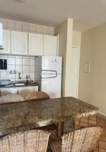 C112 Apartamento de 1 quarto pé na areia com vista lateral ao mar em Canasvieiras