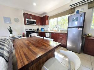 Sunny 2BR Condo with Pool Steps to Town and Beach