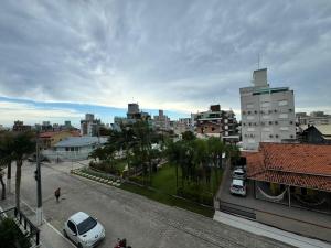 Invictus Residence 202 - Apartamento Frente Rua Decorado na Praia de Palmas a 4 Minutinhos do Mar