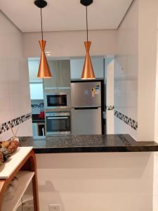 Apartamento confortável com suíte na Praia Grande