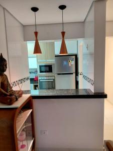 Apartamento confortável com suíte na Praia Grande