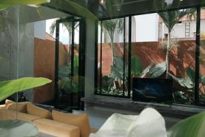 Abasan Tropical Brutalism villa