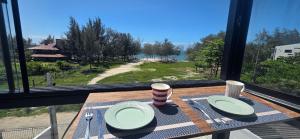 cobertura pé na areia com banheira vista mar