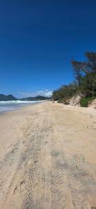 cobertura pé na areia com banheira vista mar