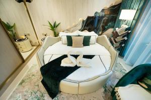 Binghatti Aurora, JVC Dubai - Unique Round Bed Experience with pool view