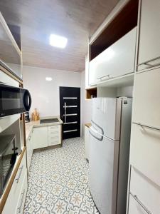 SlimHaus pé na AREIA