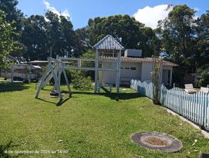 Casa em Tramandaí dentro de condomínio com área de uso comum na beira da lagoa do armazém a 4,5 km da beira mar