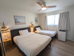 Bohemian 3-Bedroom Beach Condo with AC, Patio & Mid Size Parking