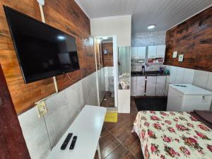 Suite com cozinha conjugada