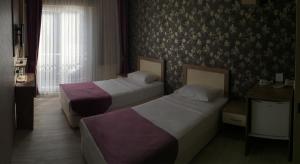 Standard Twin Room room in Udi Hotel