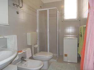 Spacious apartment with terrace and pool in Bibione