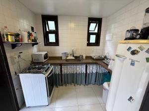 Casarão em condomínio Pé na Areia em Praia Grande!